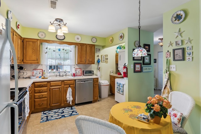 2710 Bybrook Dr, Cape May Beach, NJ 08251 - kitchen with stainless steel dishwasher, range, brown cabinets, and light countertops