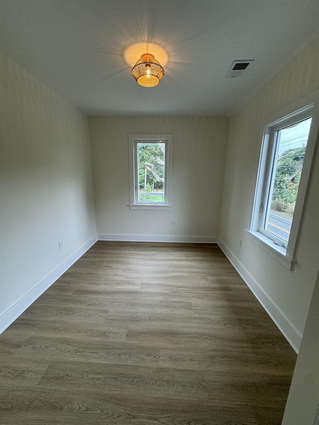 spare room featuring hardwood / wood-style floors