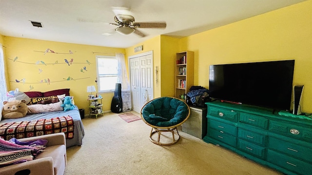 interior space with ceiling fan and light carpet