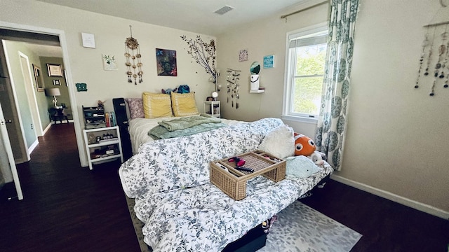 bedroom featuring dark hardwood / wood-style flooring