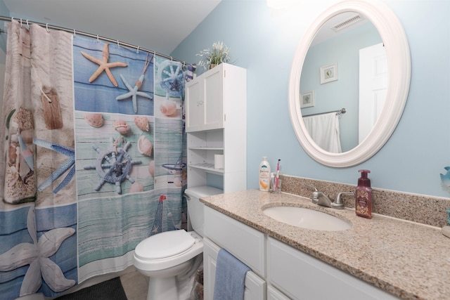bathroom featuring vanity, toilet, and a shower with shower curtain