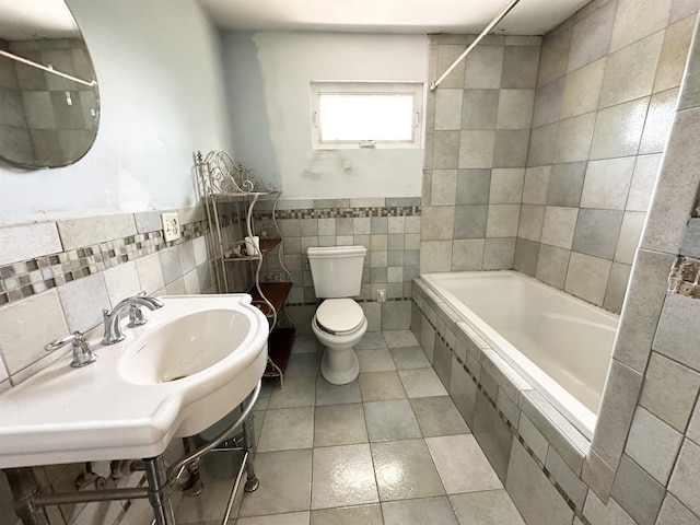 110 S 9th St, Del Haven, NJ 08251 - full bathroom with tile walls, toilet, tiled shower / bath combo, tile patterned flooring, and a sink