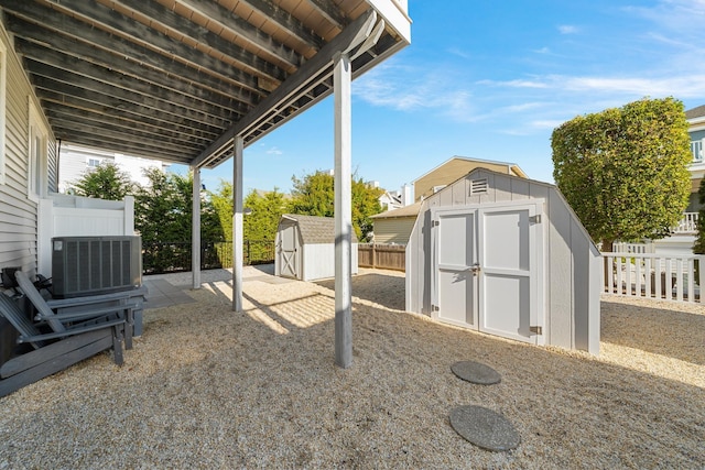 260 83rd St Unit 1, Stone Harbor, NJ 08247 - view of yard with a storage shed, central AC, an outdoor structure, and fence