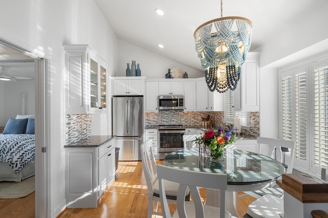 260 83rd St Unit 1, Stone Harbor, NJ 08247 - dining room with light wood-style floors, lofted ceiling, recessed lighting, and a chandelier