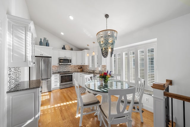 260 83rd St Unit 1, Stone Harbor, NJ 08247 - dining room featuring a chandelier, lofted ceiling, light wood-type flooring, and recessed lighting
