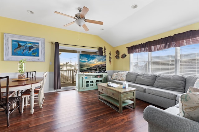 living room featuring vaulted ceiling, dark hardwood / wood-style floors, and ceiling fan