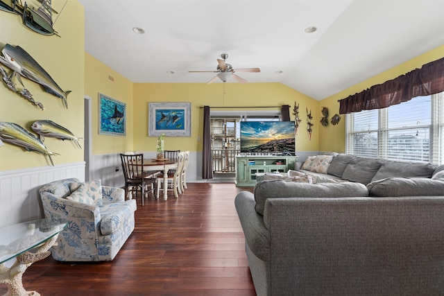 living room featuring lofted ceiling, dark hardwood / wood-style floors, and ceiling fan