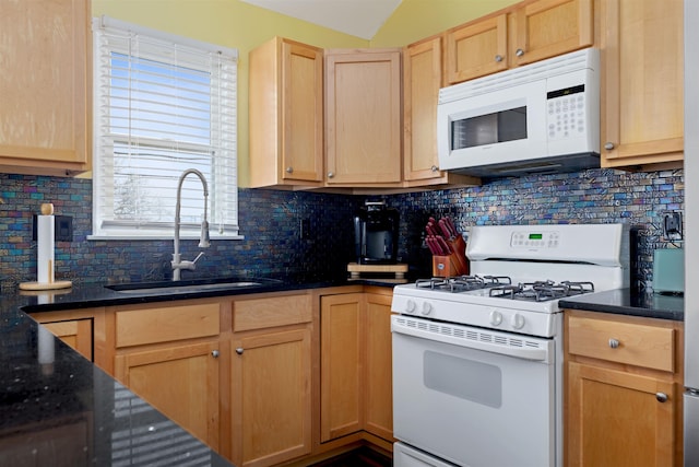 kitchen featuring tasteful backsplash, white appliances, light brown cabinetry, and sink