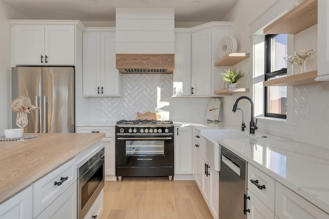 615 W Spruce Ave, North Wildwood, NJ 08260 - kitchen featuring white cabinetry, appliances with stainless steel finishes, a sink, and open shelves