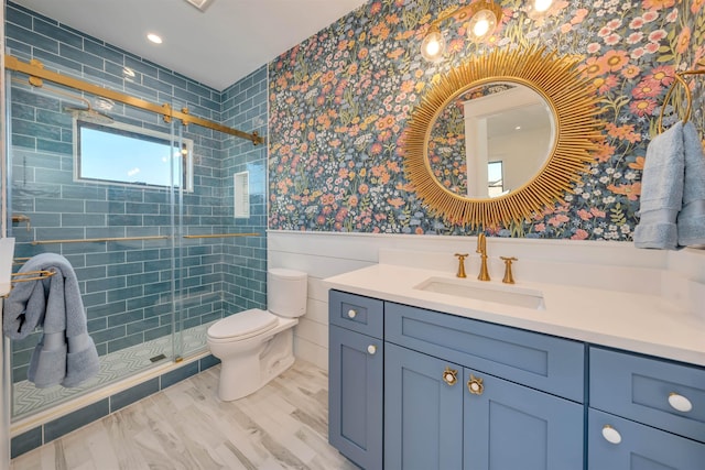 615 W Spruce Ave, North Wildwood, NJ 08260 - bathroom with vanity, a stall shower, toilet, wainscoting, and wood finished floors