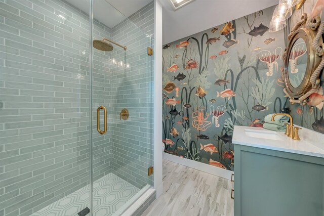 615 W Spruce Ave, North Wildwood, NJ 08260 - full bath featuring a stall shower, wallpapered walls, wood finished floors, and vanity