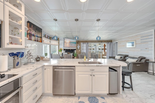 902 Ocean Dr Unit 302, Lower Township, NJ 08204 - kitchen featuring stainless steel dishwasher, open floor plan, an ornate ceiling, range, and a sink