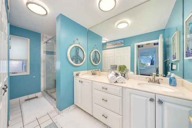 902 Ocean Dr Unit 302, Lower Township, NJ 08204 - bathroom with a shower stall, double vanity, connected bathroom, and tile patterned flooring