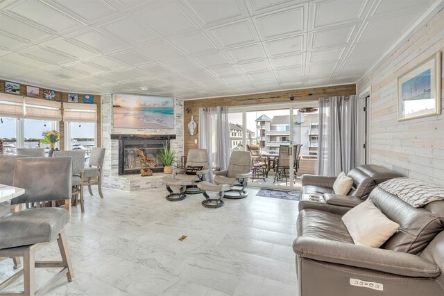 902 Ocean Dr Unit 302, Lower Township, NJ 08204 - living area featuring wooden walls, healthy amount of natural light, a fireplace, and an ornate ceiling