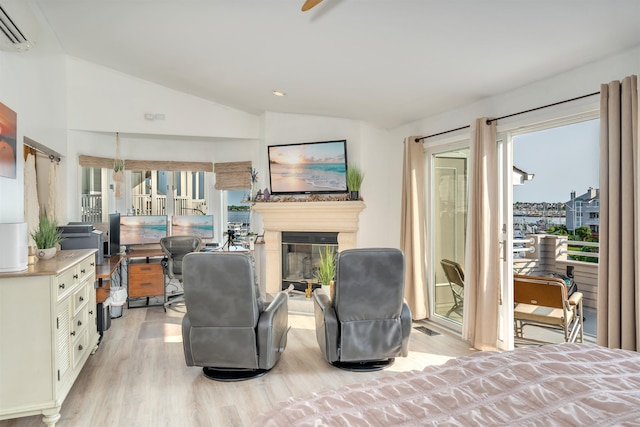 902 Ocean Dr Unit 302, Lower Township, NJ 08204 - bedroom featuring light wood finished floors, lofted ceiling, a wall mounted AC, access to exterior, and multiple windows