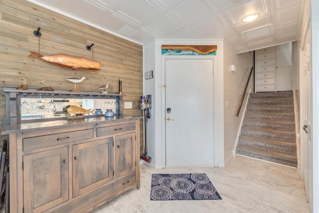 902 Ocean Dr Unit 302, Lower Township, NJ 08204 - entryway featuring wood walls, stairs, light marble finish floors, and an ornate ceiling