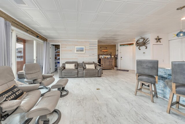 902 Ocean Dr Unit 302, Lower Township, NJ 08204 - living area with wood walls, an ornate ceiling, and marble finish flooring
