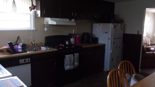 309 E Topeka Ave, Wildwood Crest, NJ 08260 - kitchen featuring tasteful backsplash, sink, and white appliances
