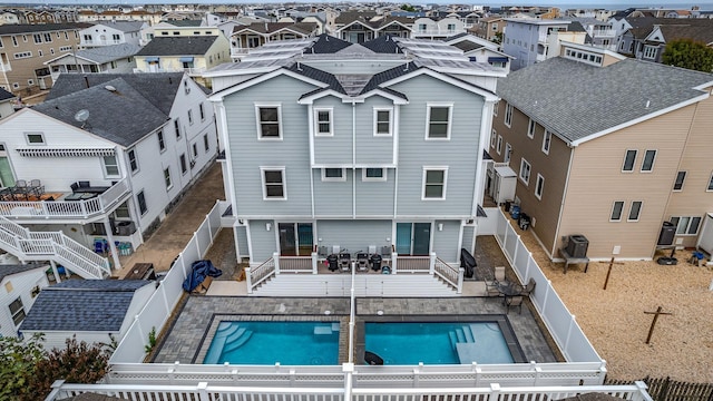 exterior space with a fenced in pool