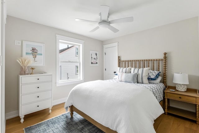 bedroom with wood-type flooring and ceiling fan