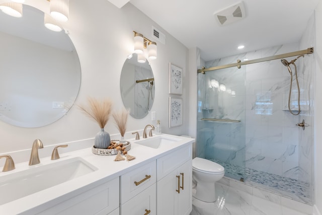 bathroom with toilet, a shower with shower door, and vanity