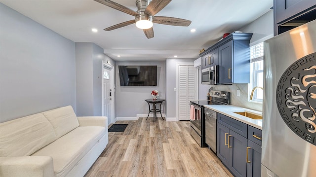 5407 Pacific Ave Unit 13, Wildwood Crest, NJ 08260 - kitchen with appliances with stainless steel finishes, light wood finished floors, ceiling fan, recessed lighting, and light countertops