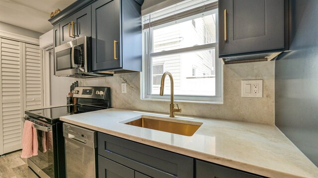 5407 Pacific Ave Unit 13, Wildwood Crest, NJ 08260 - kitchen with appliances with stainless steel finishes, light countertops, plenty of natural light, and light wood-type flooring