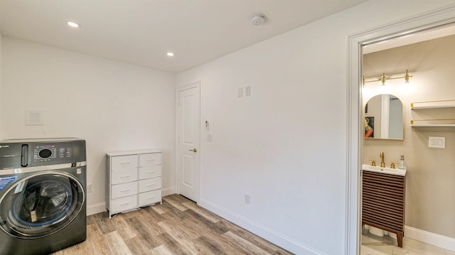 5407 Pacific Ave Unit 13, Wildwood Crest, NJ 08260 - laundry room featuring washer / dryer, light wood-style flooring, recessed lighting, and bar area