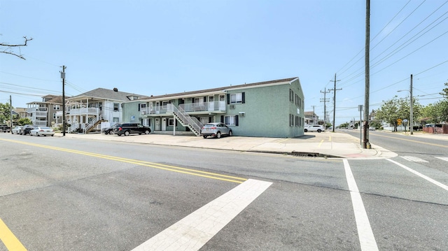 5407 Pacific Ave Unit 13, Wildwood Crest, NJ 08260 - view of asphalt road with sidewalks, stairway, curbs, and street lighting