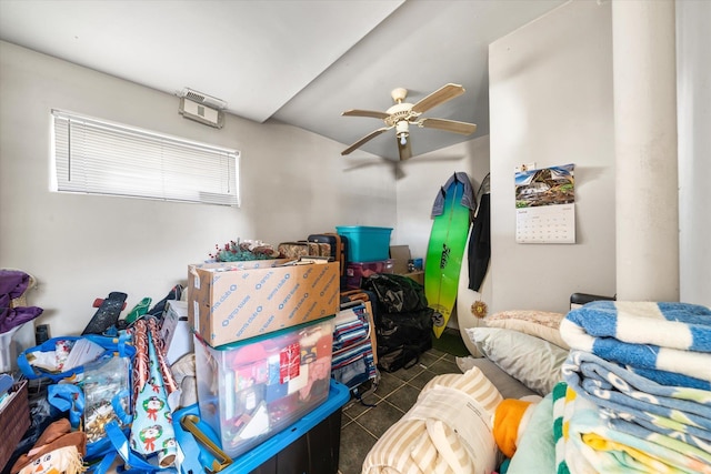 interior space featuring tile patterned flooring and ceiling fan