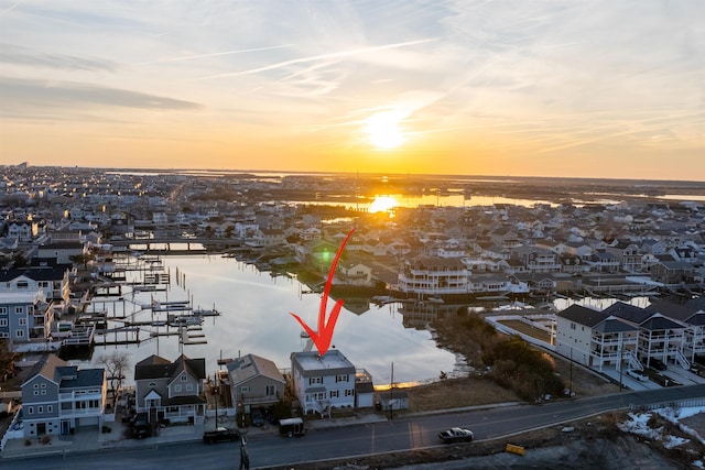 aerial view at dusk with a water view