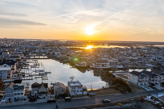 aerial view at dusk with a water view