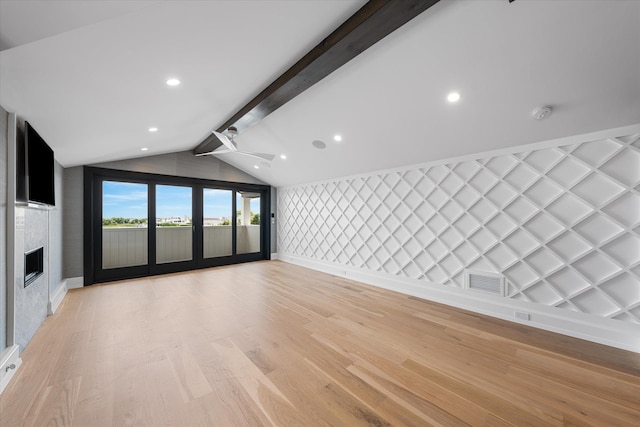 unfurnished living room featuring light wood-type flooring, vaulted ceiling with beams, and ceiling fan