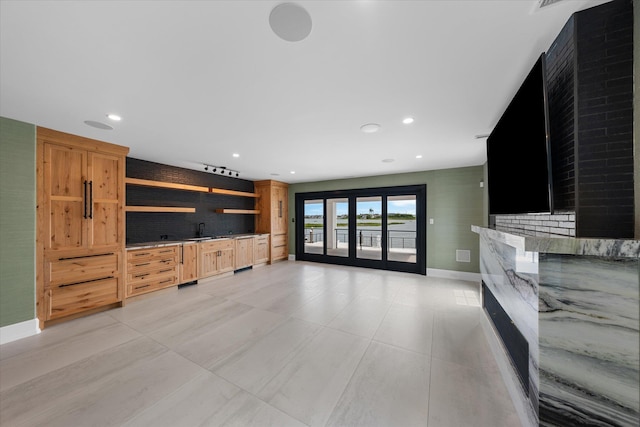 living room featuring french doors and sink