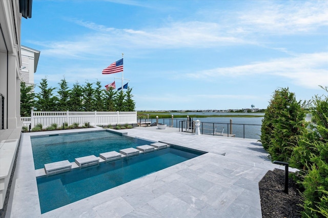 view of swimming pool featuring an in ground hot tub, a patio, and a water view