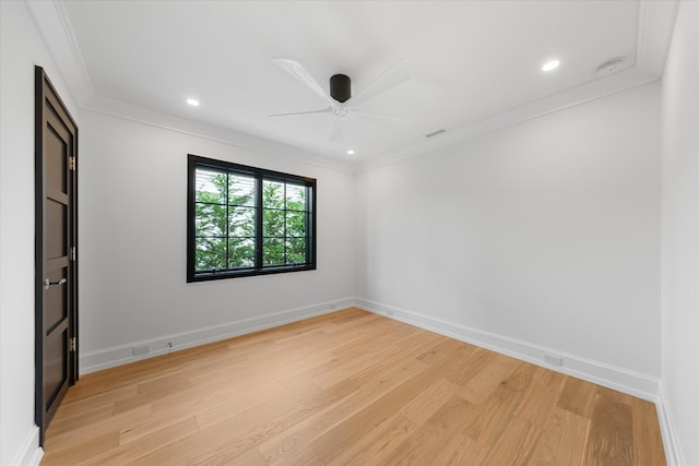 unfurnished room featuring light wood-type flooring, ceiling fan, and ornamental molding