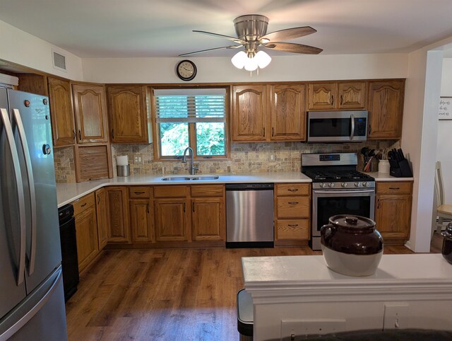 71 Perry Rd, Petersburg, NJ 08270 - kitchen with appliances with stainless steel finishes, brown cabinetry, and decorative backsplash