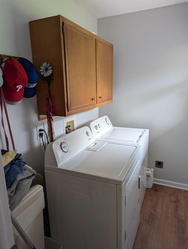 71 Perry Rd, Petersburg, NJ 08270 - washroom featuring cabinet space, separate washer and dryer, and wood finished floors
