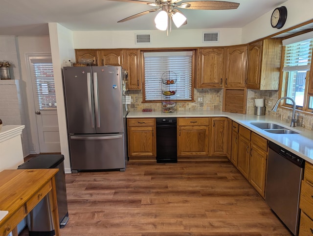 71 Perry Rd, Petersburg, NJ 08270 - kitchen featuring stainless steel appliances, ceiling fan, brown cabinetry, dark wood-style floors, and decorative backsplash