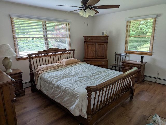 71 Perry Rd, Petersburg, NJ 08270 - bedroom with wood finished floors, a baseboard heating unit, and multiple windows