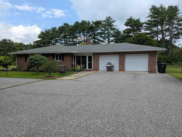 71 Perry Rd, Petersburg, NJ 08270 - ranch-style house with an attached garage, asphalt driveway, a chimney, and brick siding