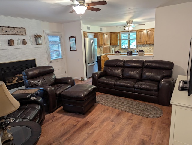 71 Perry Rd, Petersburg, NJ 08270 - living area featuring ceiling fan, wood finished floors, and a brick fireplace