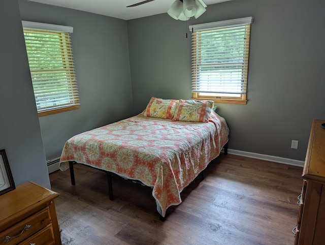 71 Perry Rd, Petersburg, NJ 08270 - bedroom featuring a baseboard radiator, wood finished floors, and a ceiling fan