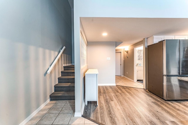 staircase featuring tile patterned floors