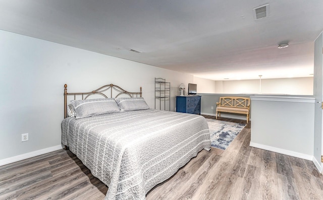 bedroom featuring hardwood / wood-style floors