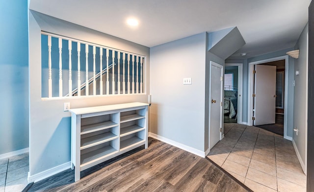 hall with hardwood / wood-style floors