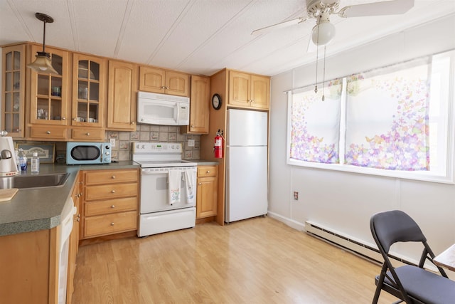 kitchen featuring sink, backsplash, hanging light fixtures, white appliances, and light hardwood / wood-style flooring