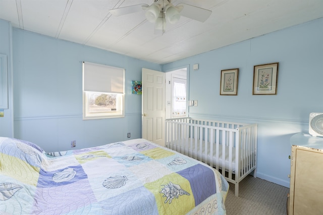 bedroom with ceiling fan and carpet