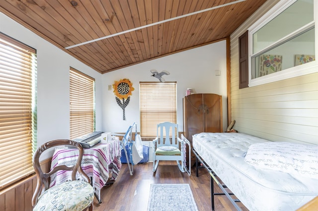 bedroom featuring dark wood-type flooring, vaulted ceiling, and wooden ceiling