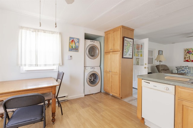 kitchen with stacked washer and clothes dryer, light brown cabinetry, light wood-type flooring, white dishwasher, and a baseboard heating unit